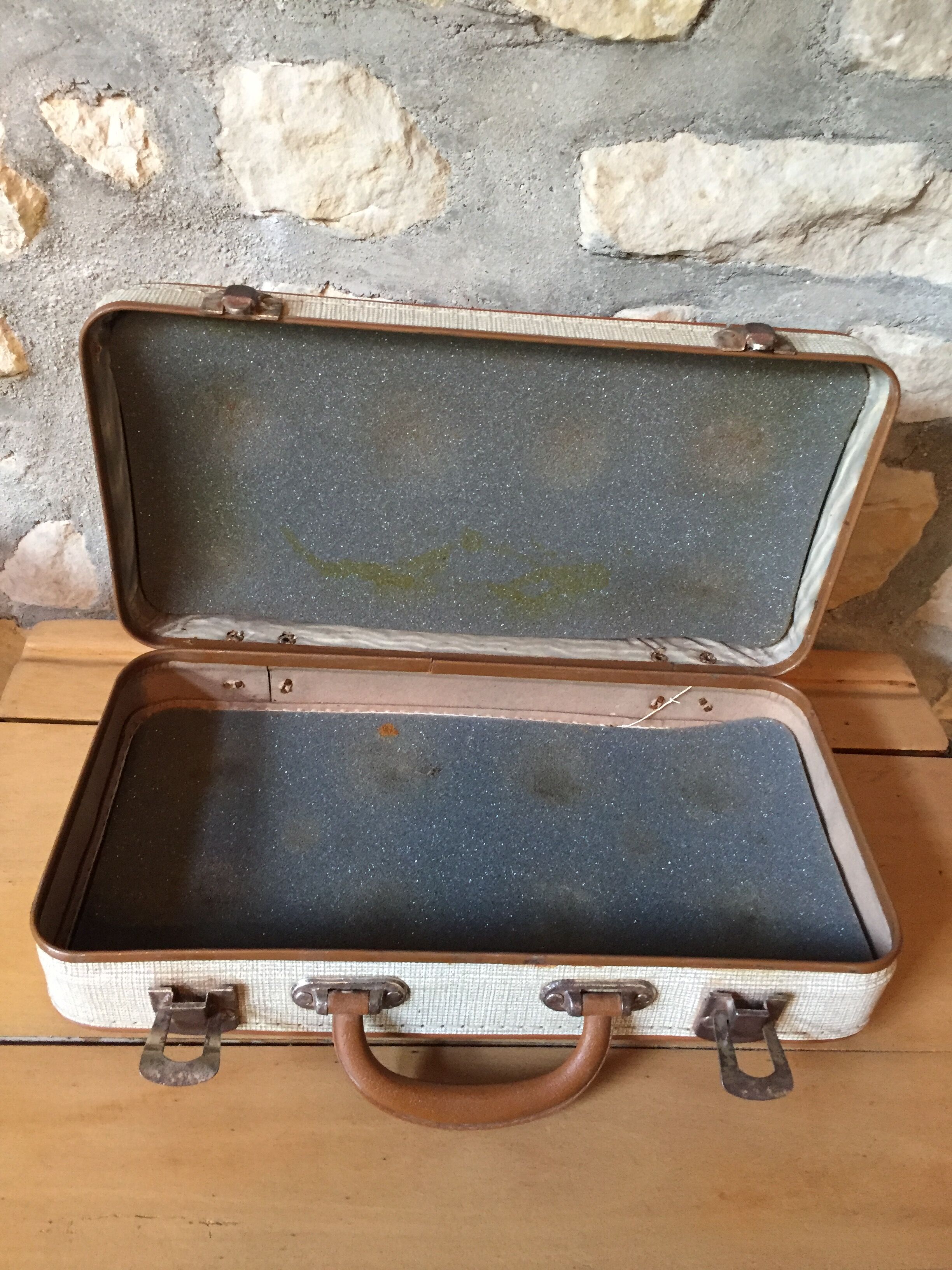 Old set of wooden balls in his suitcase
