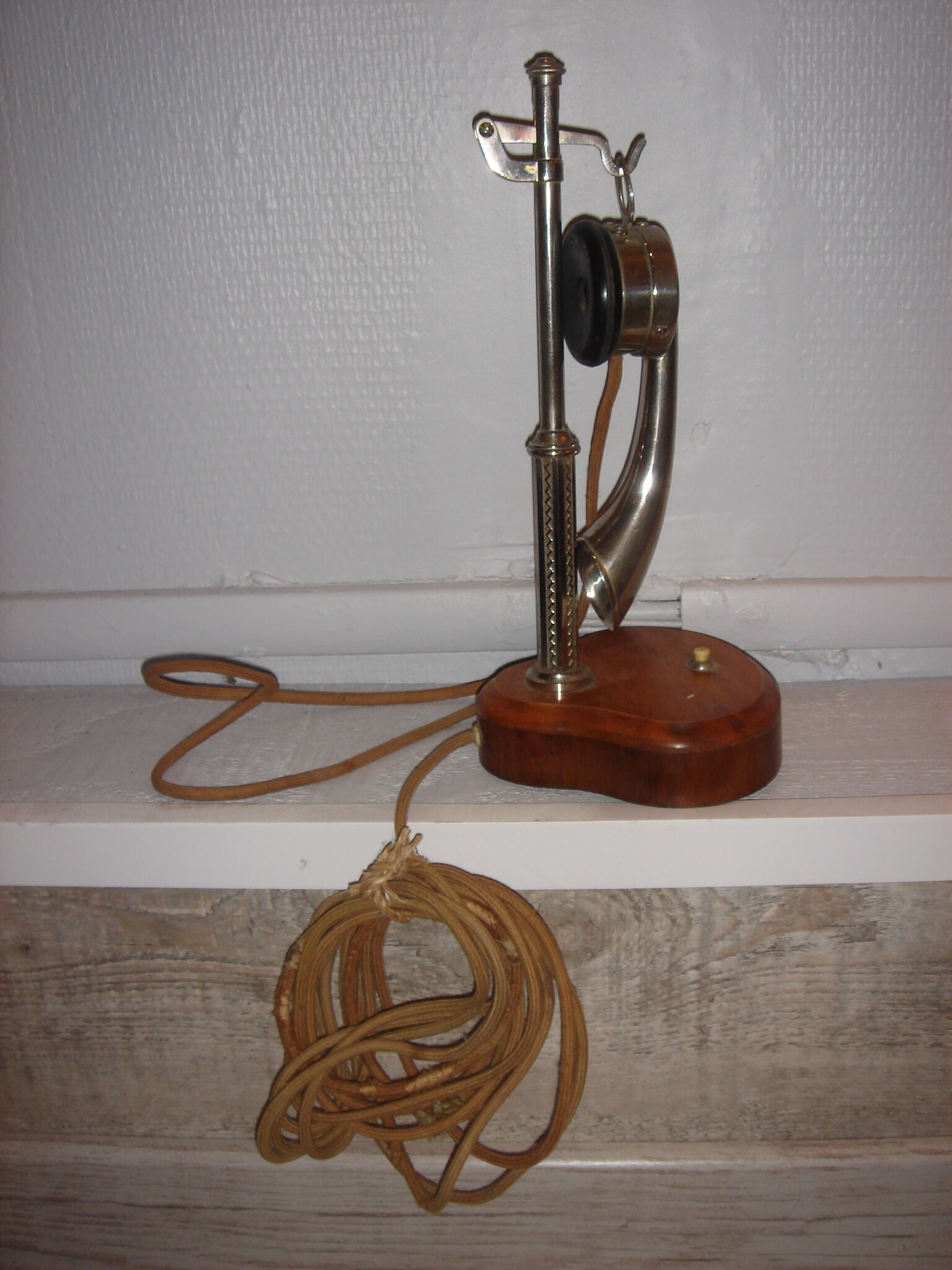 phone to cornea in 1900 on column with metal switch chrome