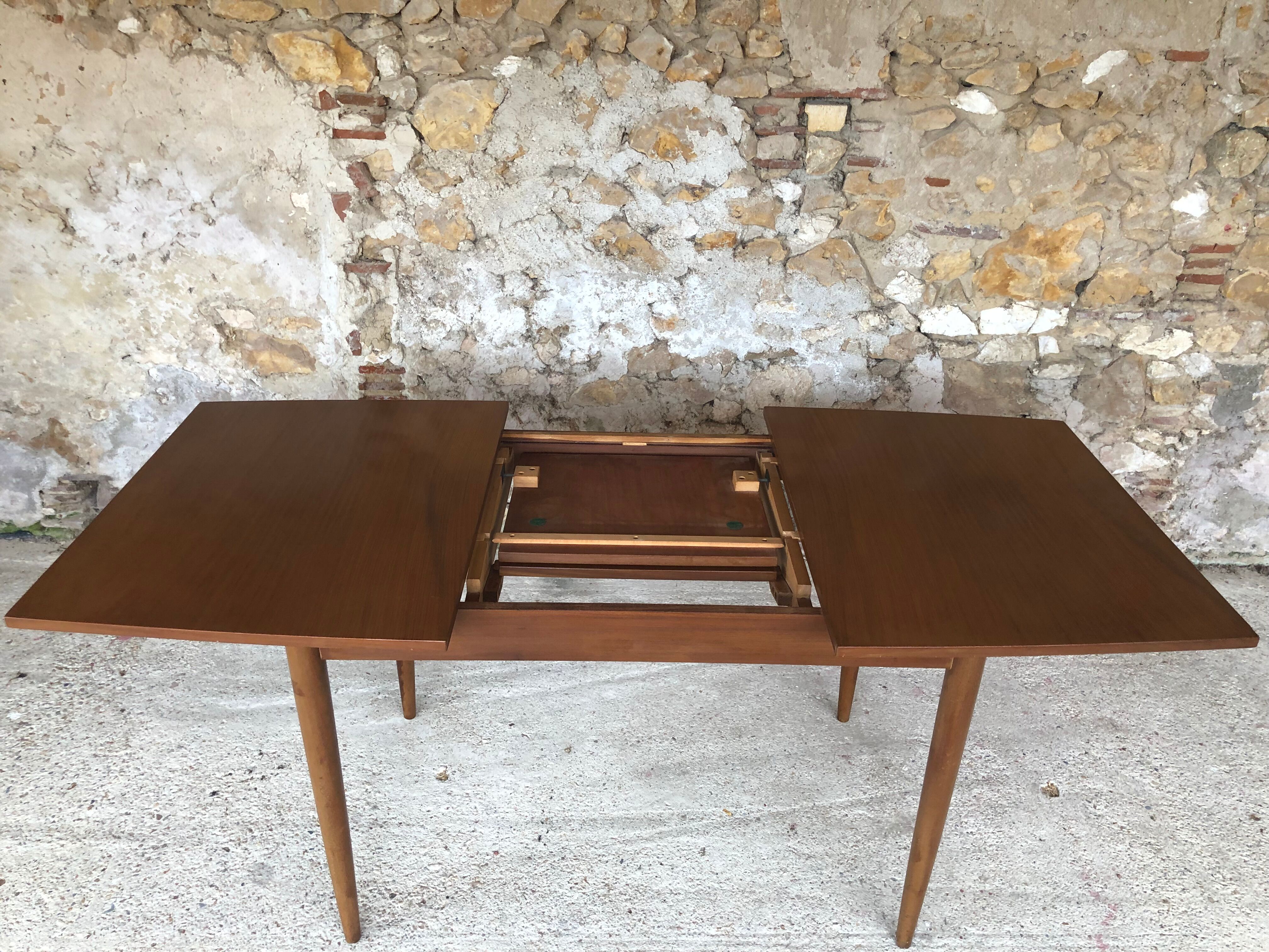 Scandinavian extension teak stretch table in butterfly ephardt by Meredew circa 60's
