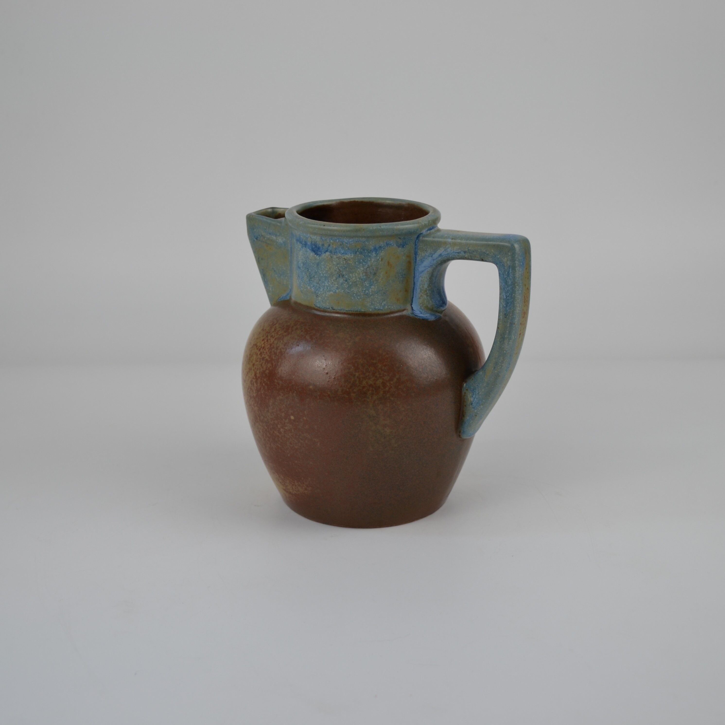 Two-tone stoneware pitcher by Louis Lourioux