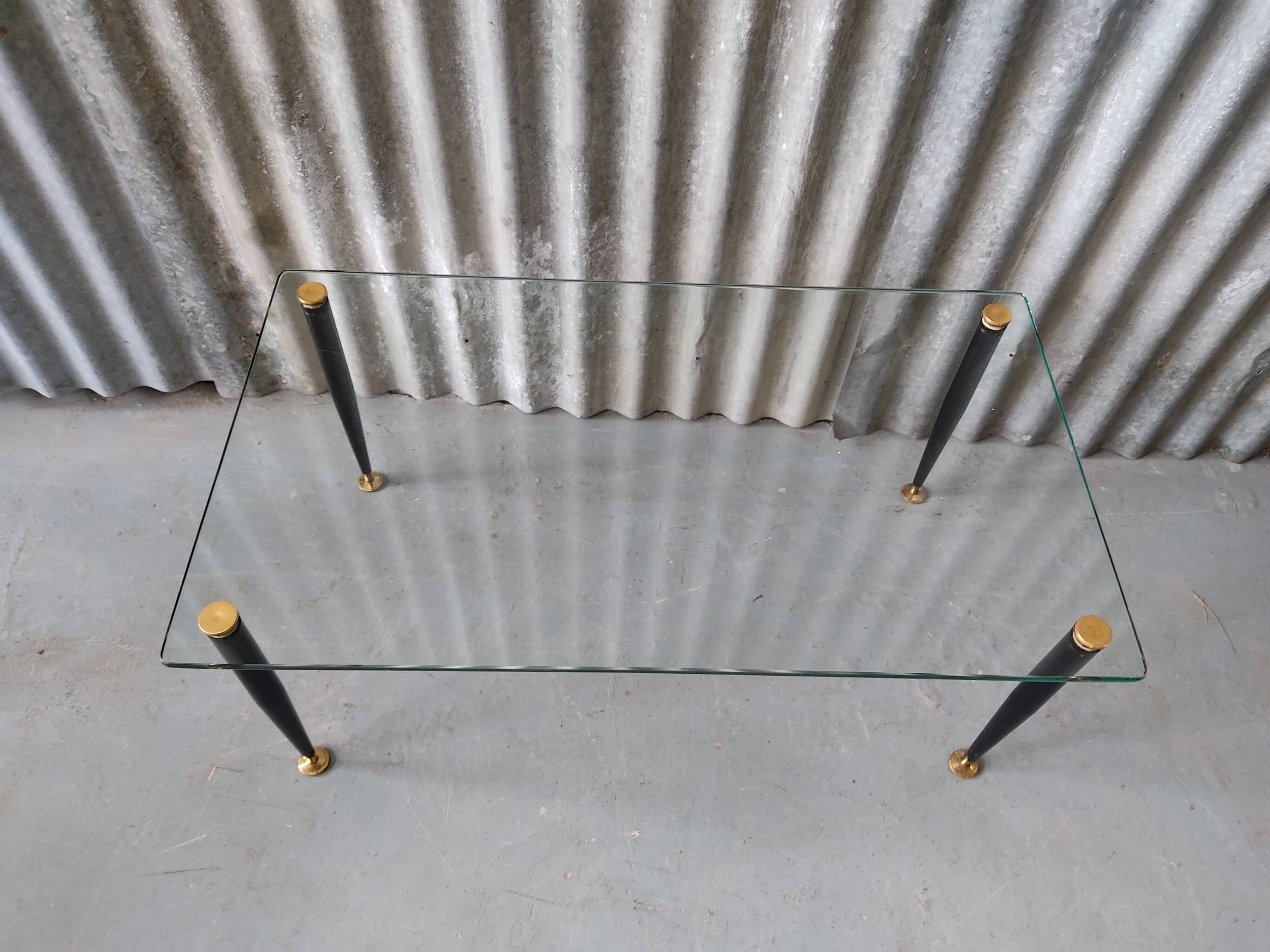 Glass and black metal coffee table