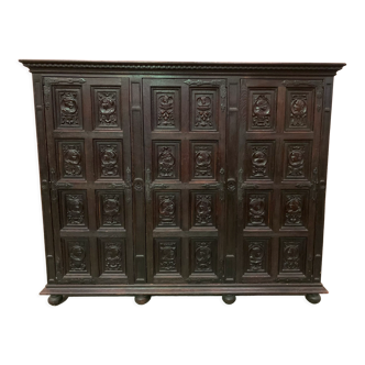 Storage cabinet has three doors Renaissance XX century style