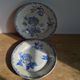 2 flat plates mismatched iron earth with blue flower motifs France