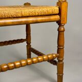 Chaise d'angle vintage en bois avec assise en paille tissée