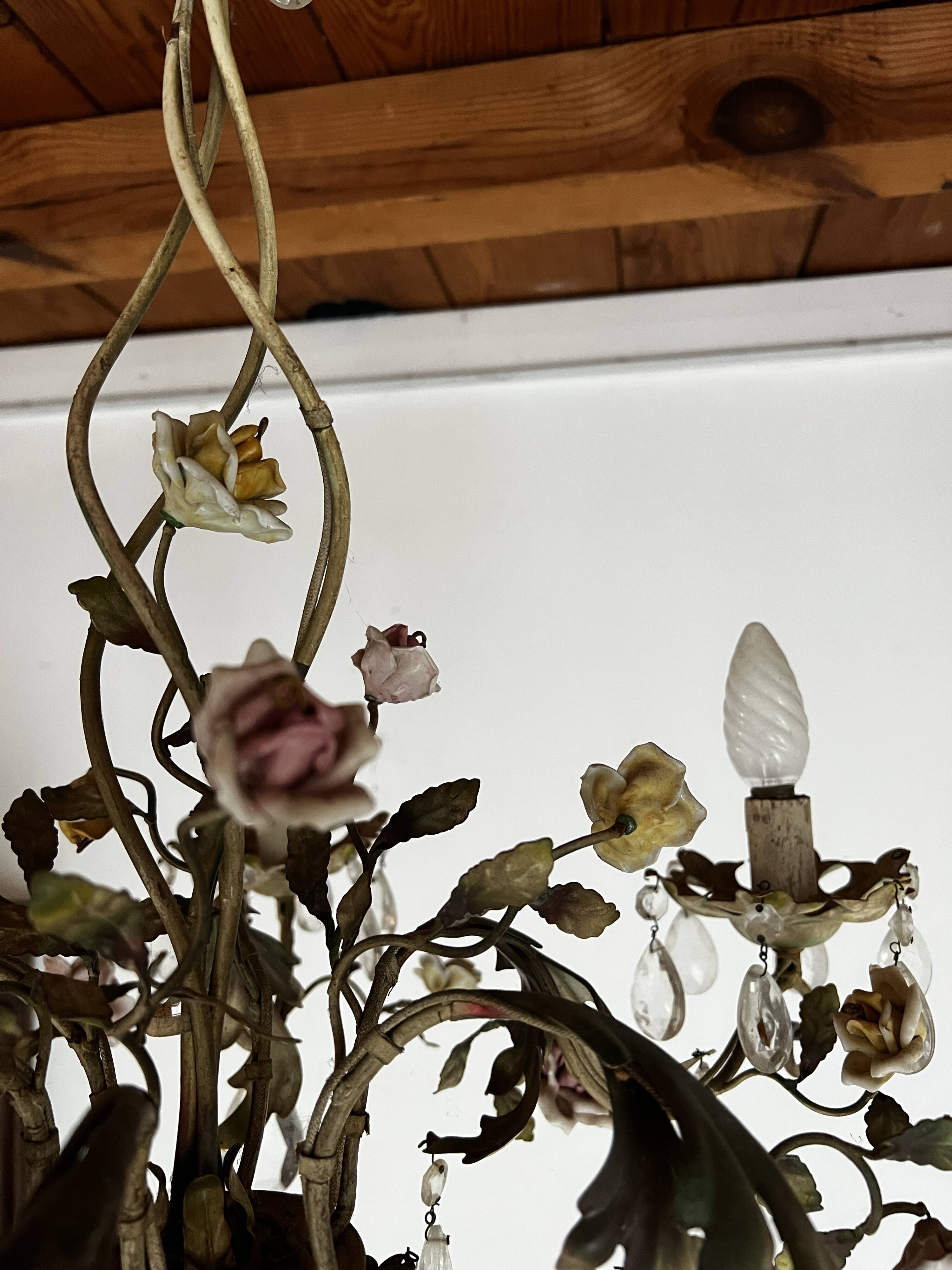 Chandelier with a floral porcelain decoration and pendants