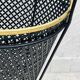 Vintage black perforated metal and brass umbrella stand