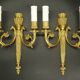 Pair of wall sconces, quiver and eagle heads, Louis XVI style - gilded bronze