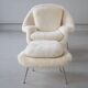 Womb Chair and Ottoman in fluffy white fabric by Eero Saarinen