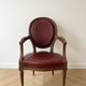 Set of 6 Louis XVI style medallion chairs and armchairs in burgundy leather.