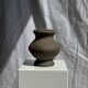 Small brutalist handcrafted terracotta vase with a pedestal, Indonesian, H19 D17.