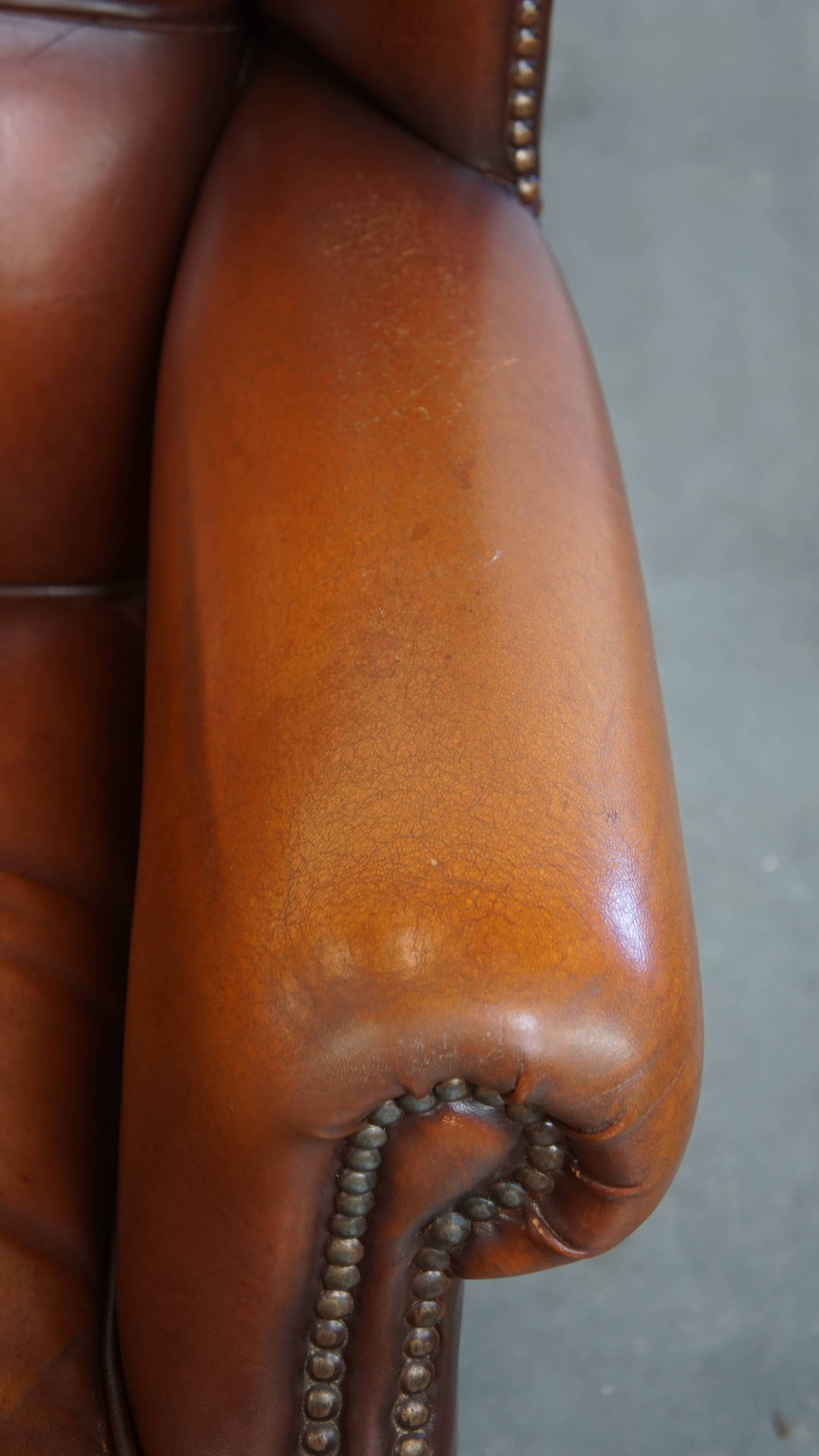 Fauteuil à oreilles en cuir de mouton
