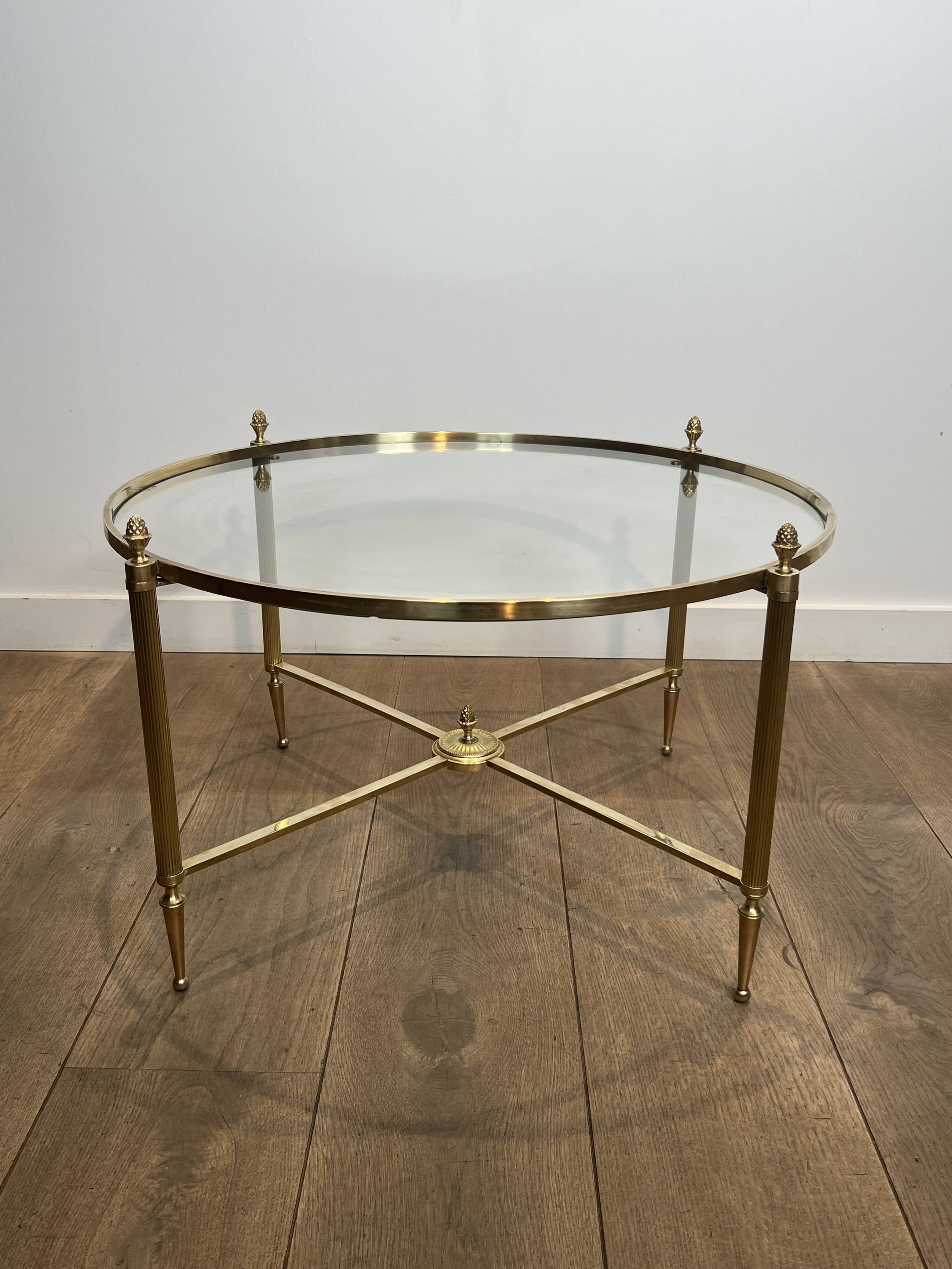 Neoclassical Round Coffee Table in Brass with Fluted Supports and Floral Motifs