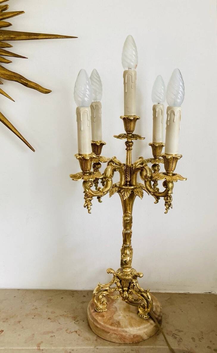 Pair of gilt bronze chandeliers, marble bases.