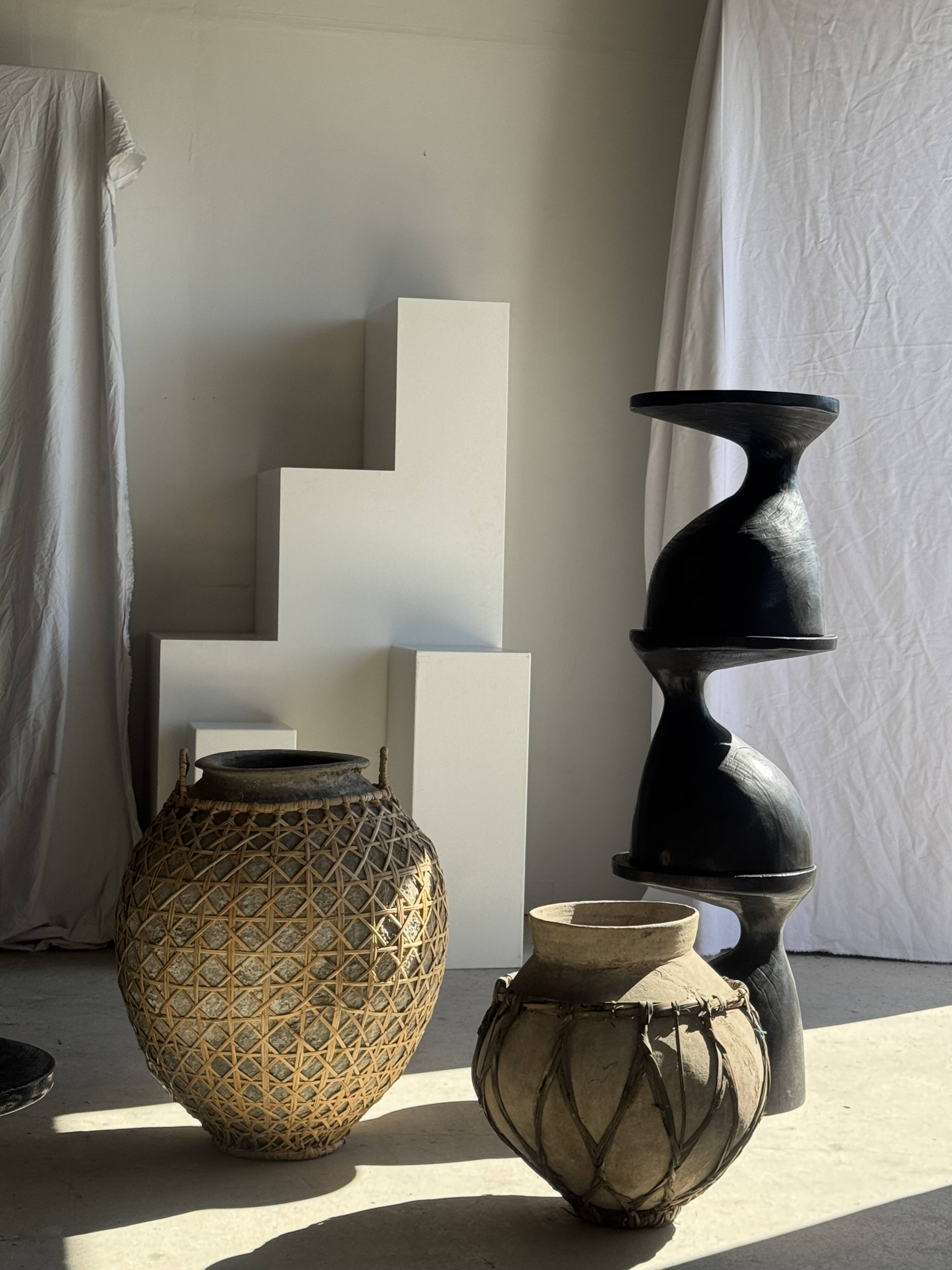 Immense light grey antique-style pot with a crosshatch lid and handles.