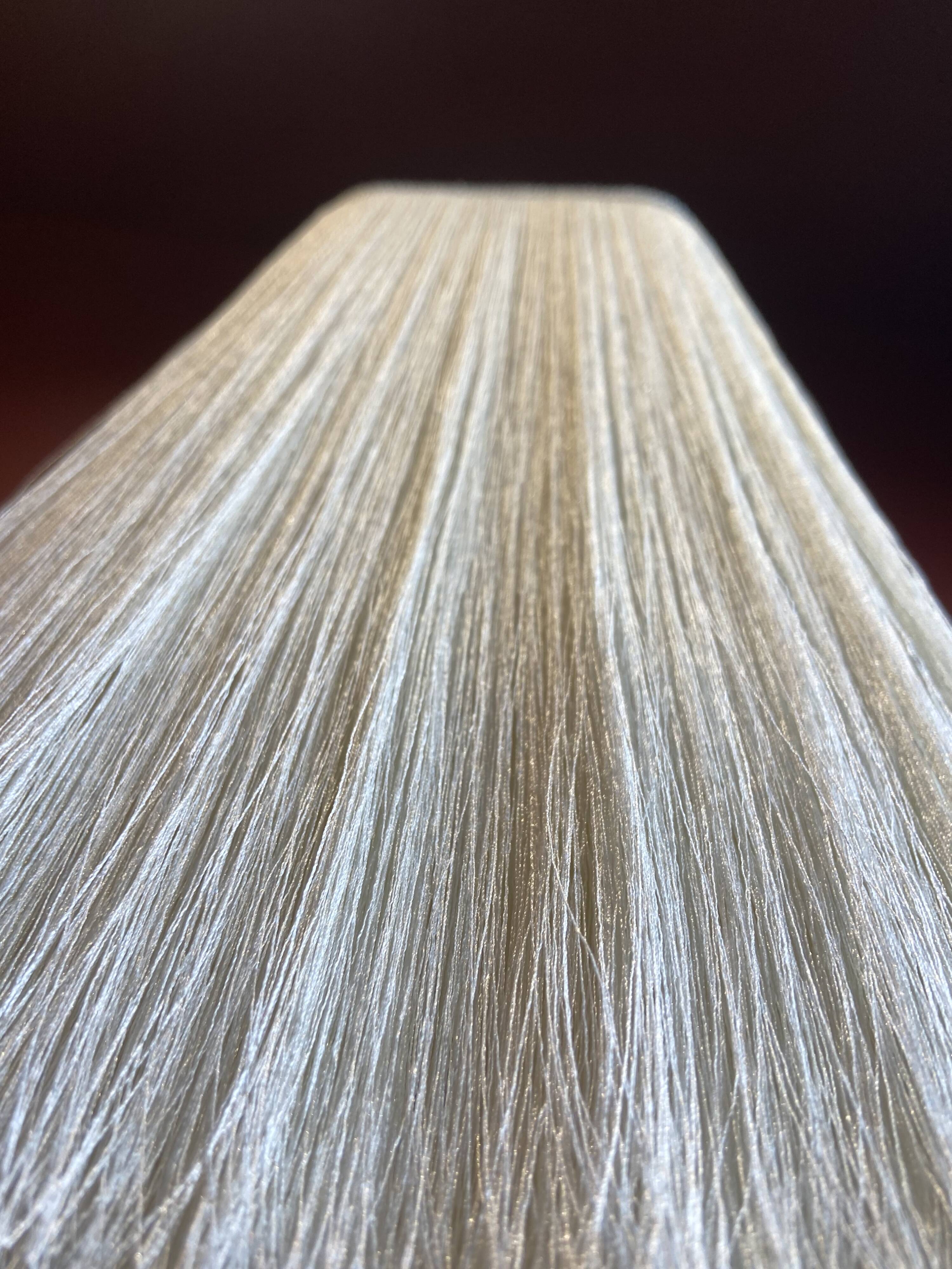 Beige marble stucco base, Houles white ecru fringed lampshade.