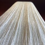 Beige marble stucco base, Houles white ecru fringed lampshade.