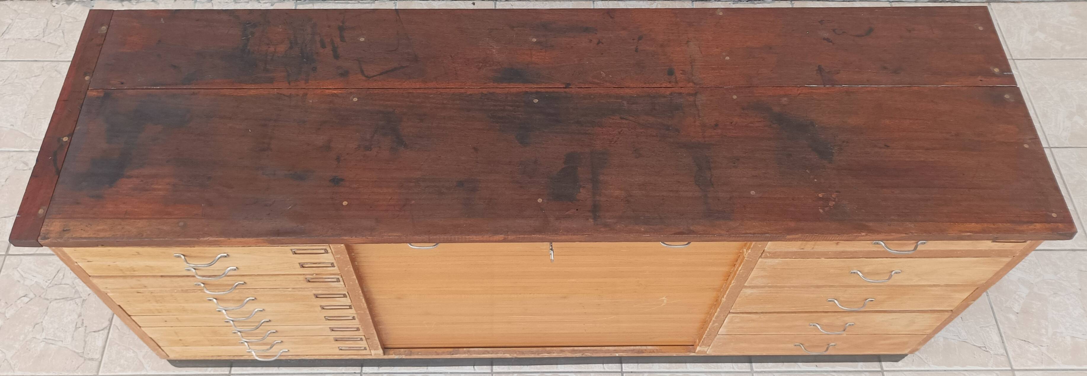 Workshop furniture with drawers and curtain in beech and walnut.