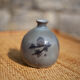Glazed terracotta ball vase