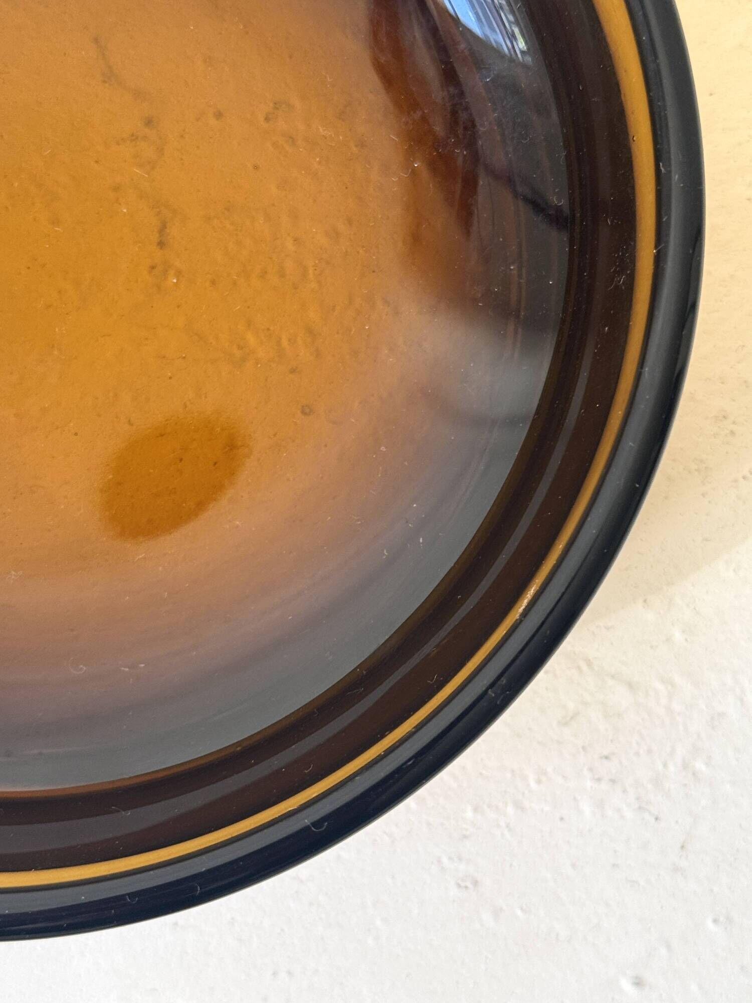 Smoked glass catchall fully tinted in amber.