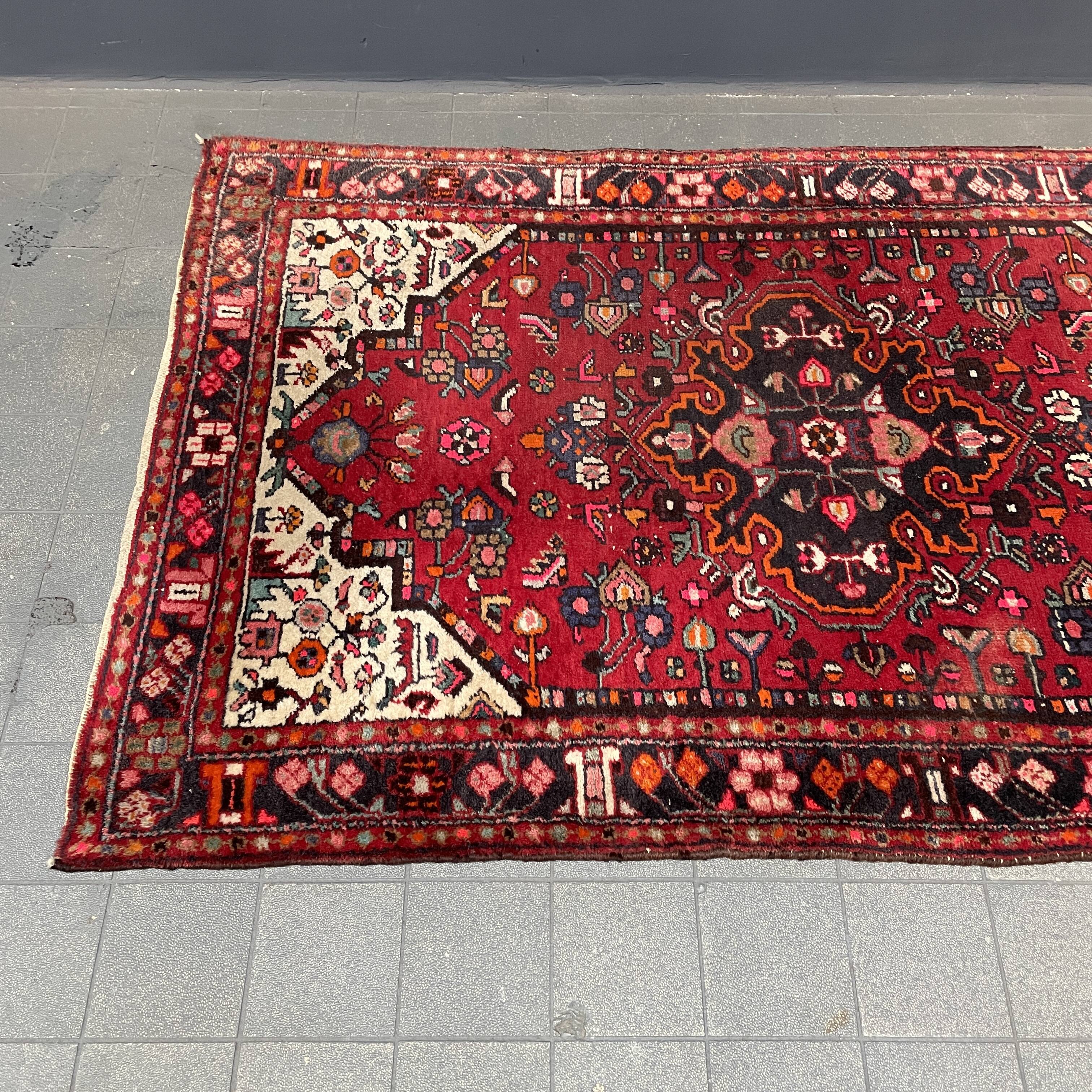 Worn vintage oriental rug or carpet