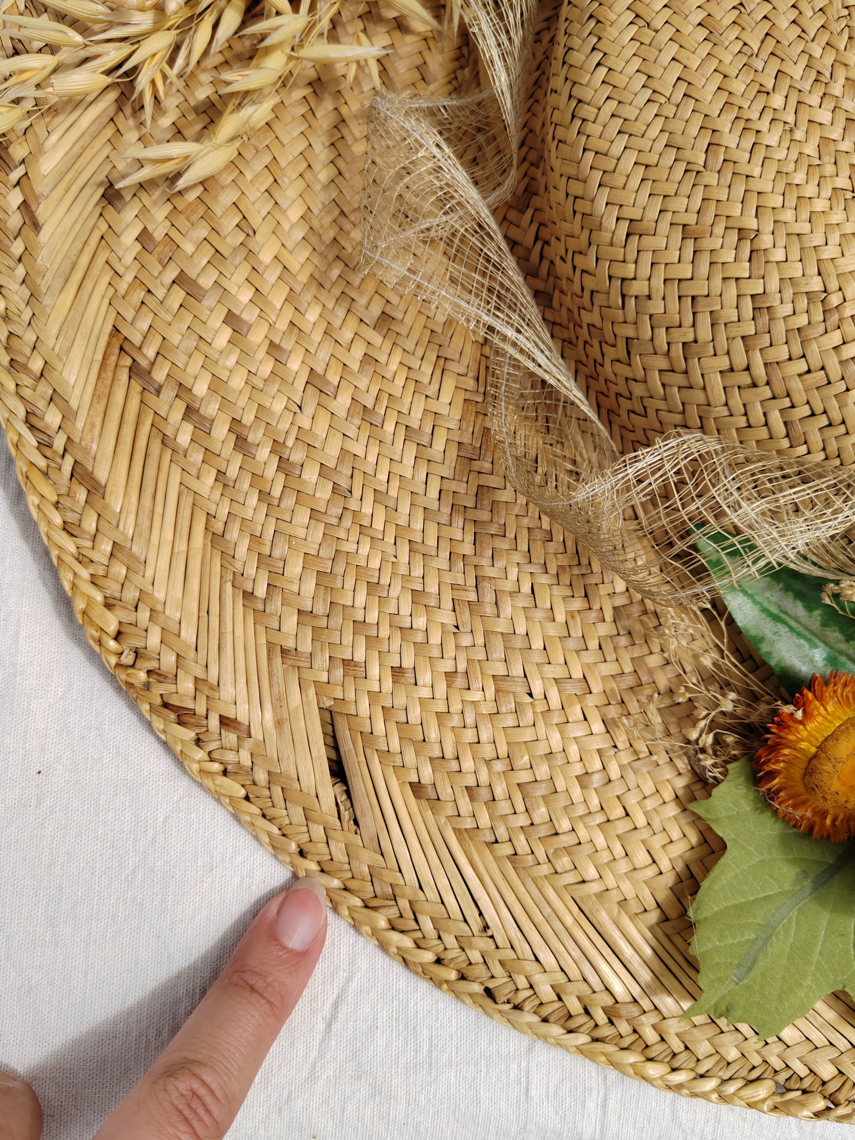 Decorative straw hat with dried flowers