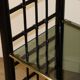 Vintage 1970s shelf in smoked glass with a bamboo-style structure.