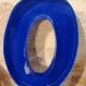 Letter O sign in blue vintage plexiglass