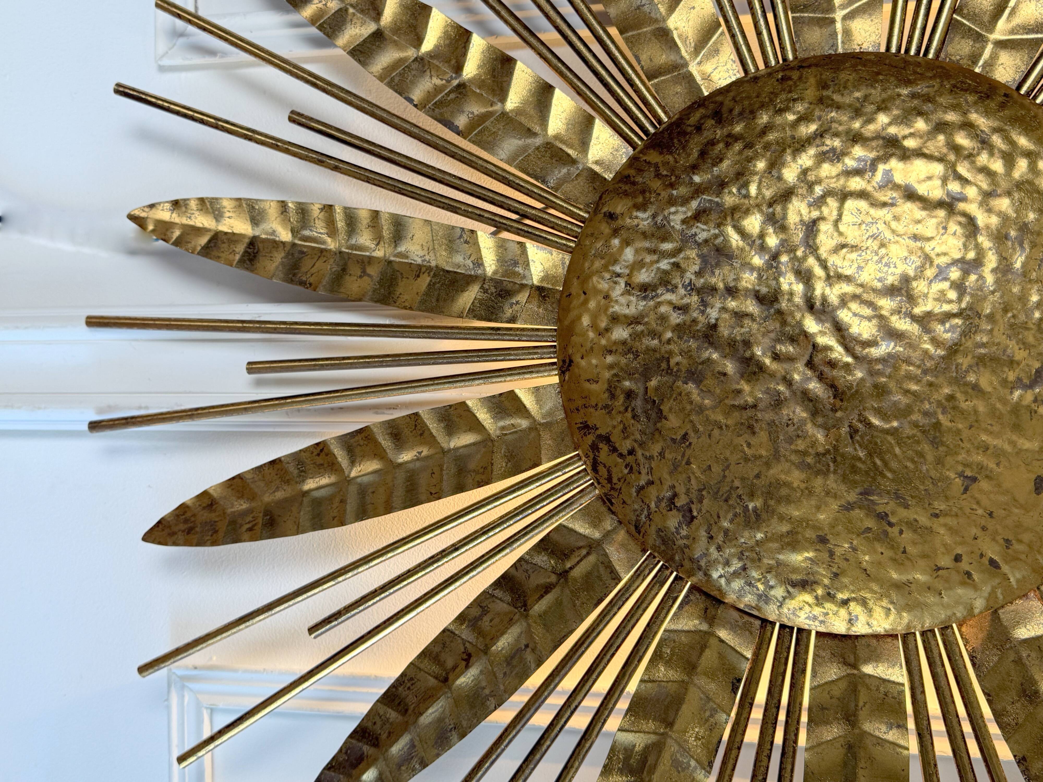 Large golden hammered metal sun wall light with a diameter of 90 cm from the year