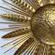 Large golden hammered metal sun wall light with a diameter of 90 cm from the year