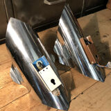 Pair space Age chrome metal wall appliques