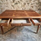 Antique French walnut table with six drawers, parquet top, early 20th century.