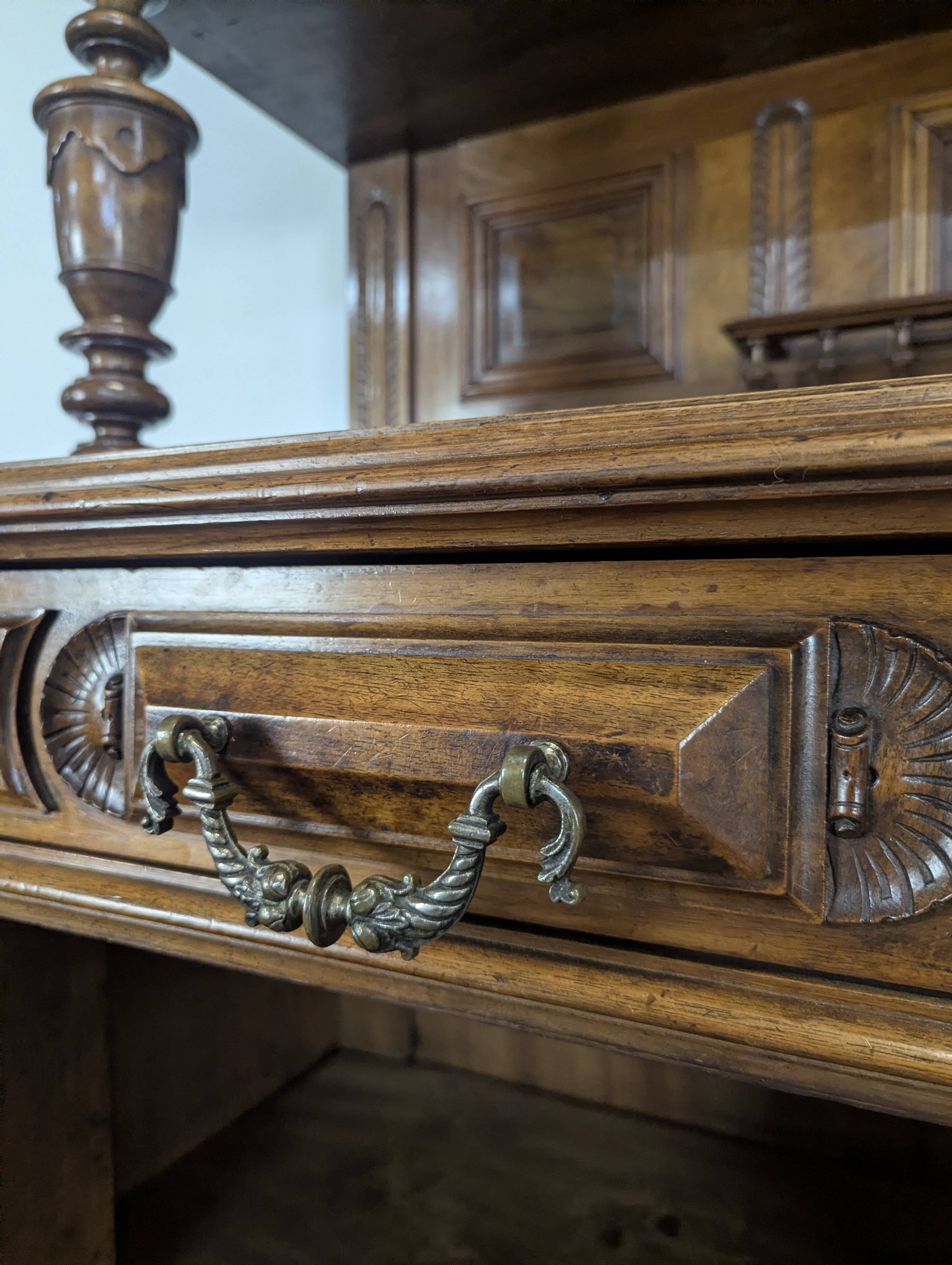 Large buffet with 2 bodies in Renaissance style made of solid walnut.