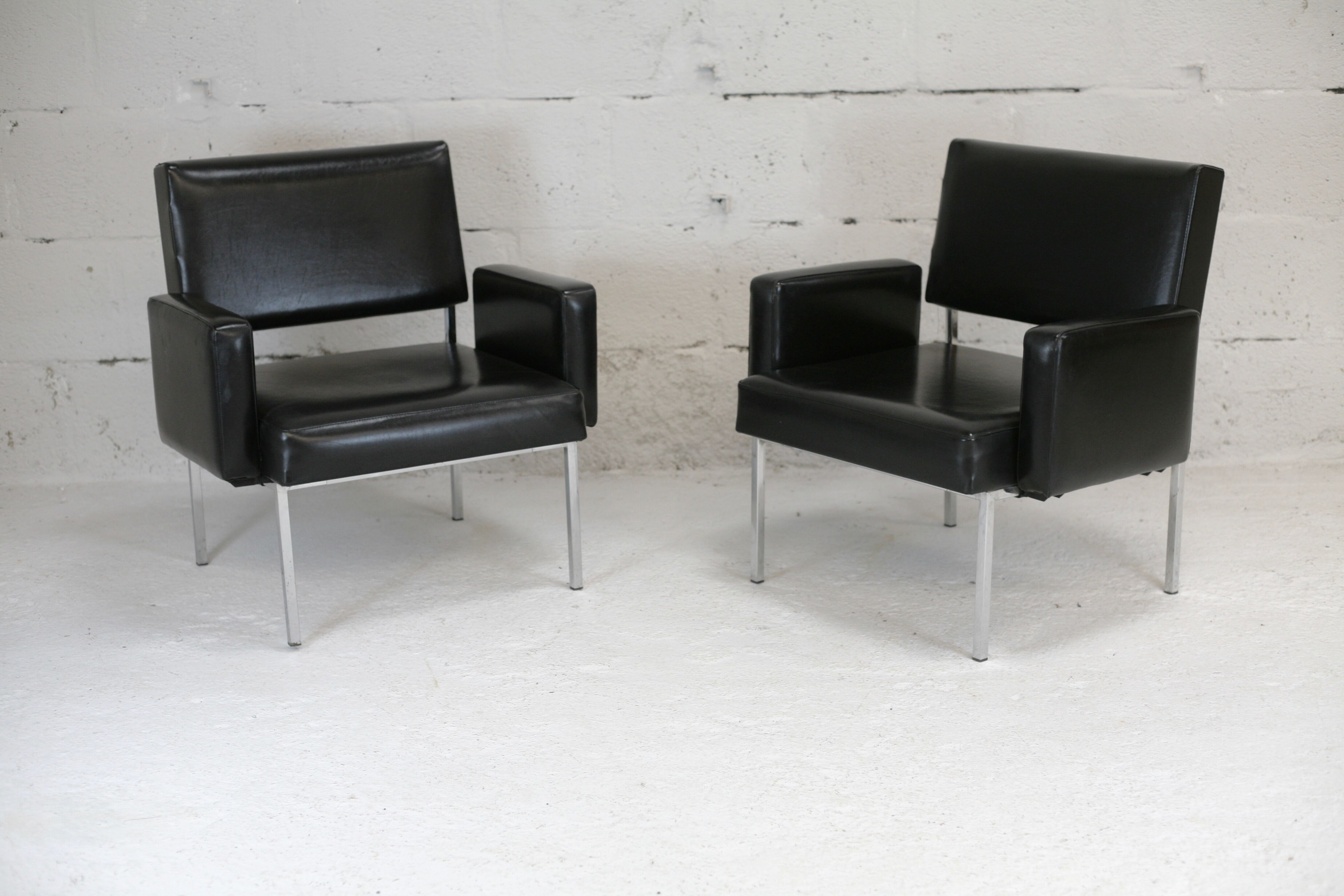 Pair of stainless steel, black leather-like armchairs, France, circa 1970