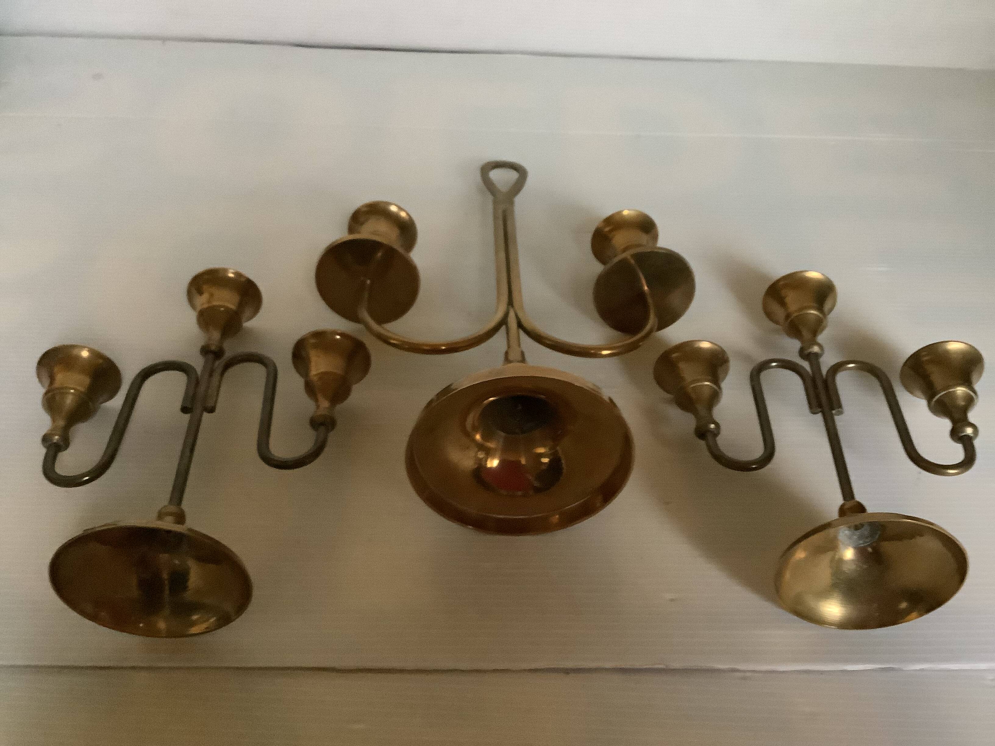 Trio of brass candlesticks with tulip bases