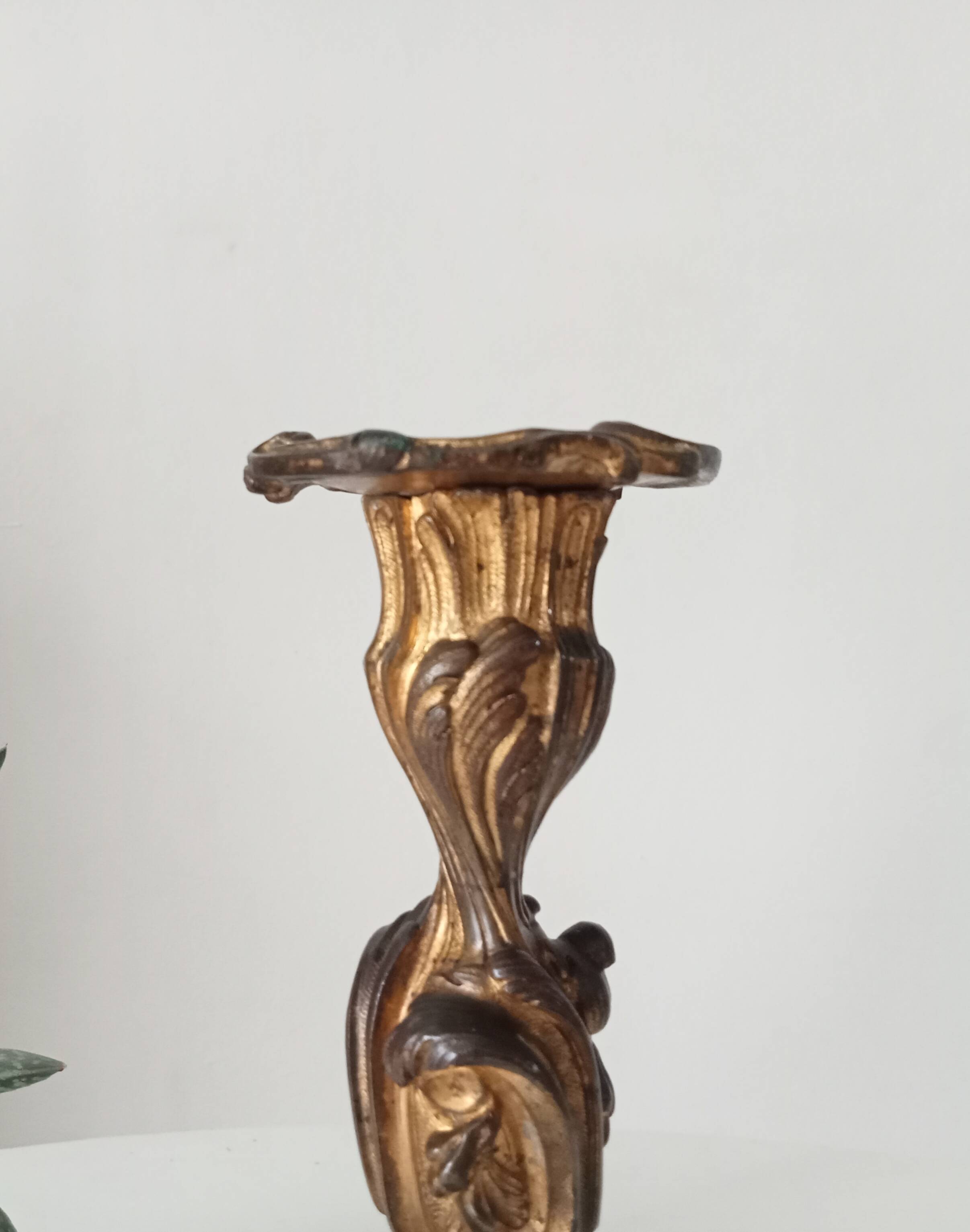 Antique 19th-century solid gilded bronze candlestick in the Louis XV style.