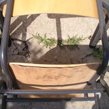 Pair of stackable class armchairs with Bakelite armrests