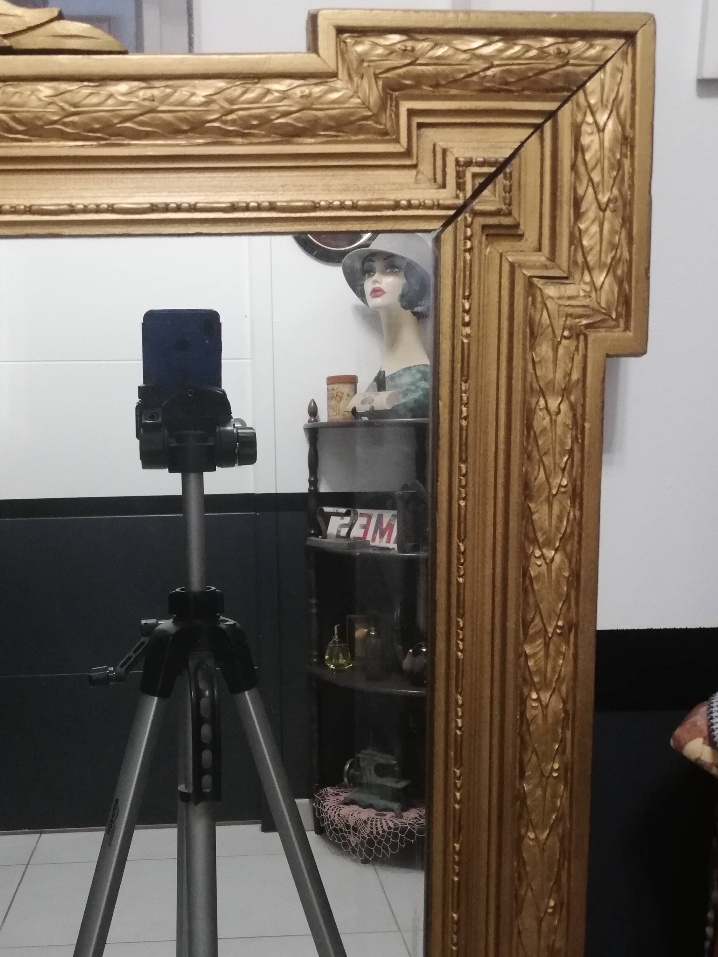 Carved wooden pediment mirror