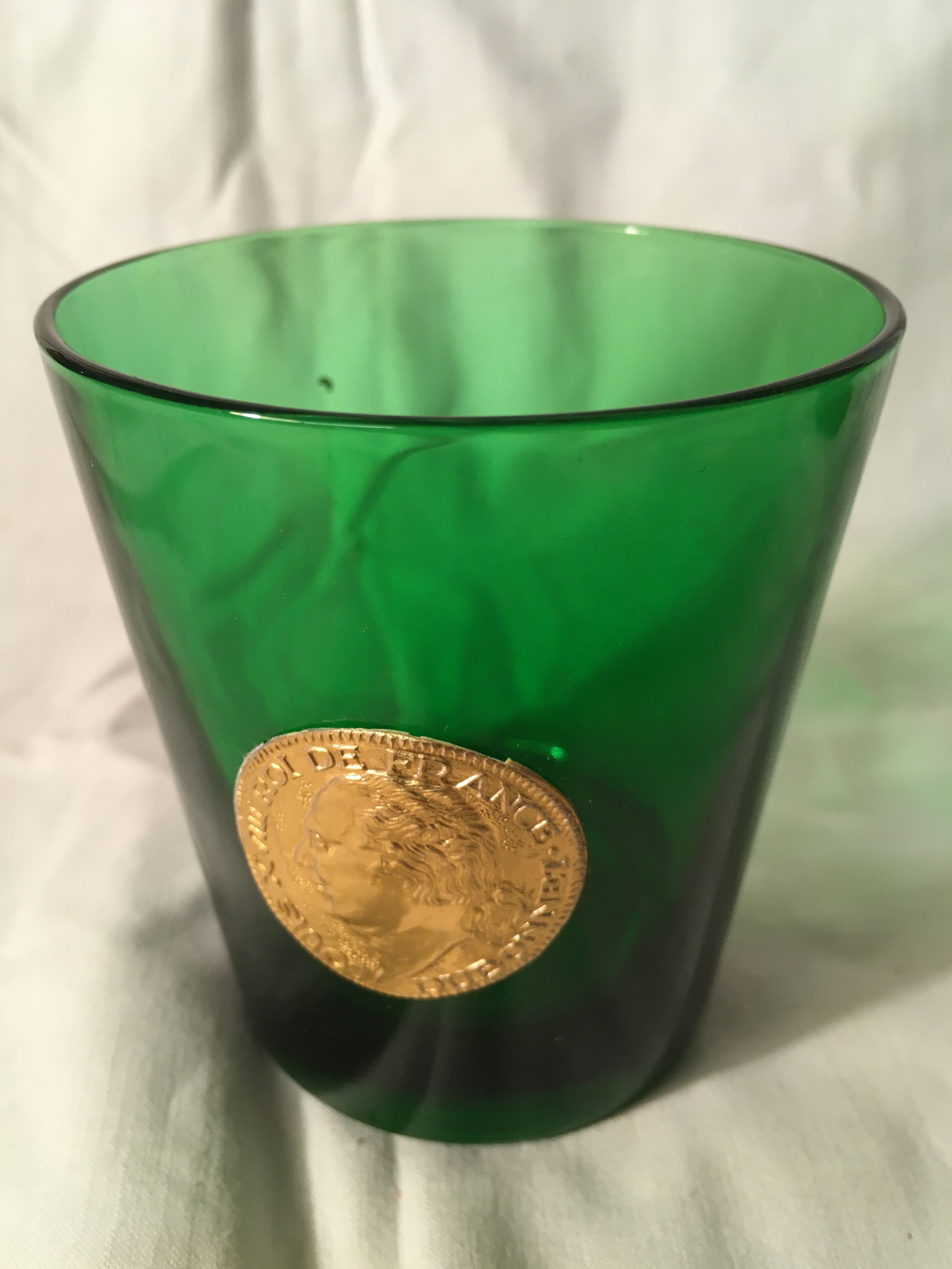 3 green glasses with silver gold shields