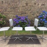 Vintage swivel chairs with chrome tubular base and silver skaï brand unic desing.