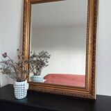 Miroir bois sculpté patine doré