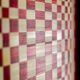 Pair of panels in red and gold straw marquetry. Contemporary.