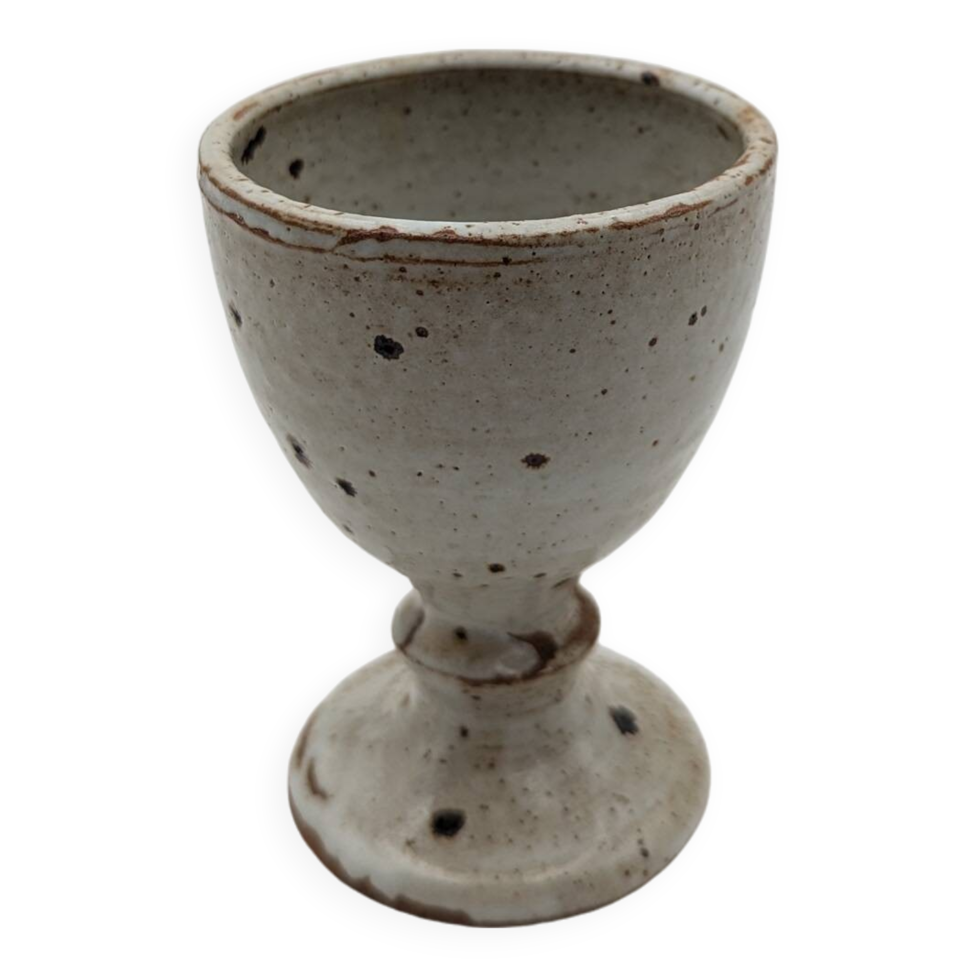 Glass on foot in pearly white stoneware with black spots