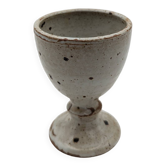 Glass on foot in pearly white stoneware with black spots