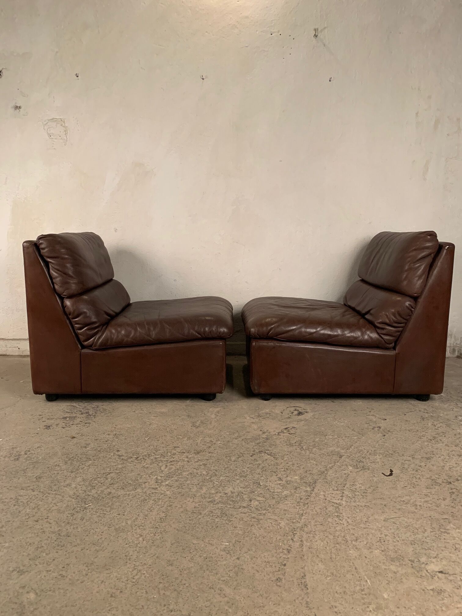 A pair of leather armchairs, Switzerland, 1970s
