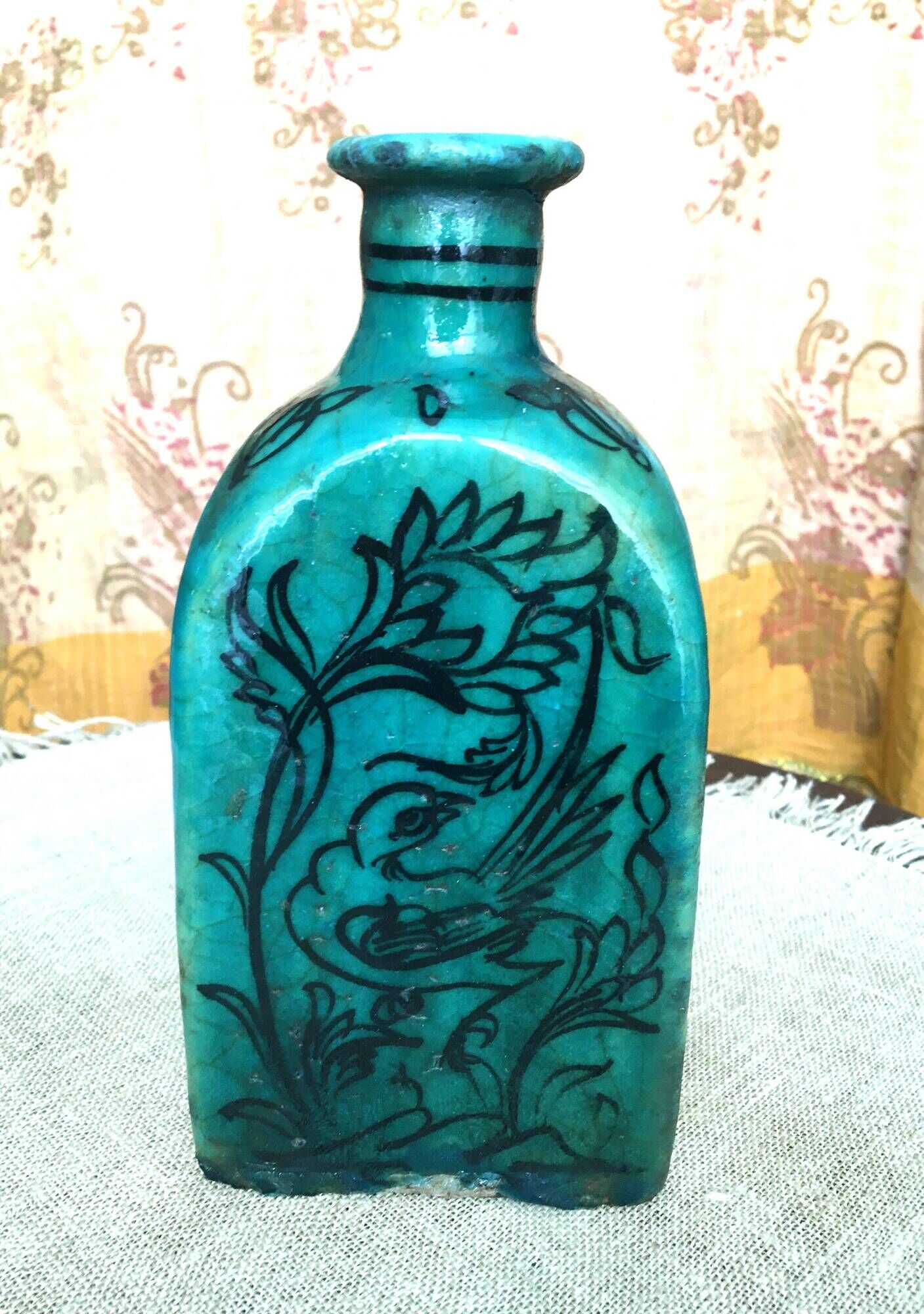 Antique Iranian three-sided blue ceramic bottle