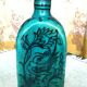Antique Iranian three-sided blue ceramic bottle