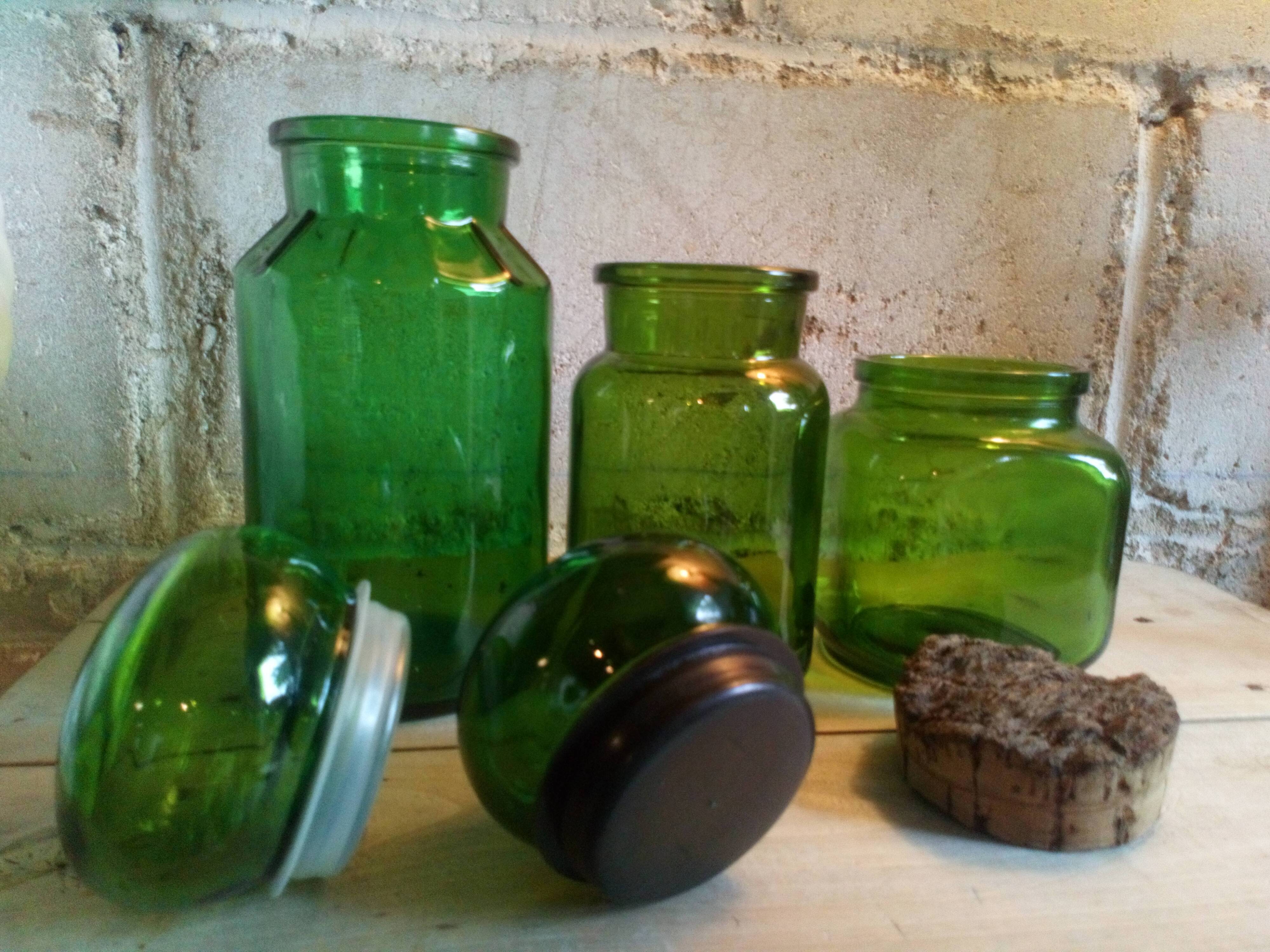 Trio of green glass apothecary bottles