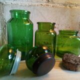 Trio of green glass apothecary bottles