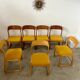 Set of 7 Baumann sled chairs in wood and mustard yellow fabric, 1960s