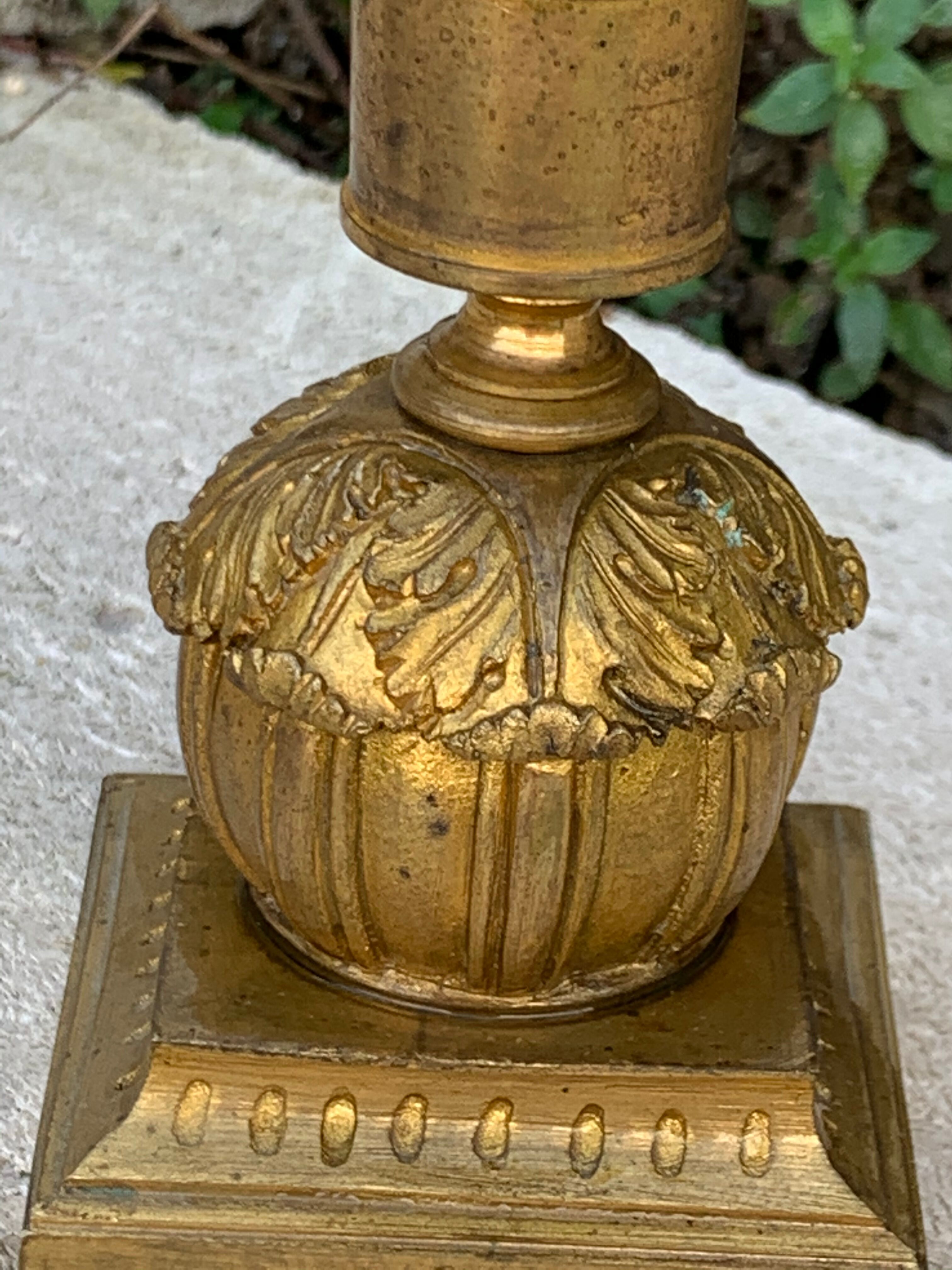 Very original old candlestick, chiseled with its gold patinated foliage